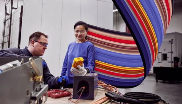 Employees collaborating at UL Solutions Electric Vehicle Laboratory in Northbrook, IL.